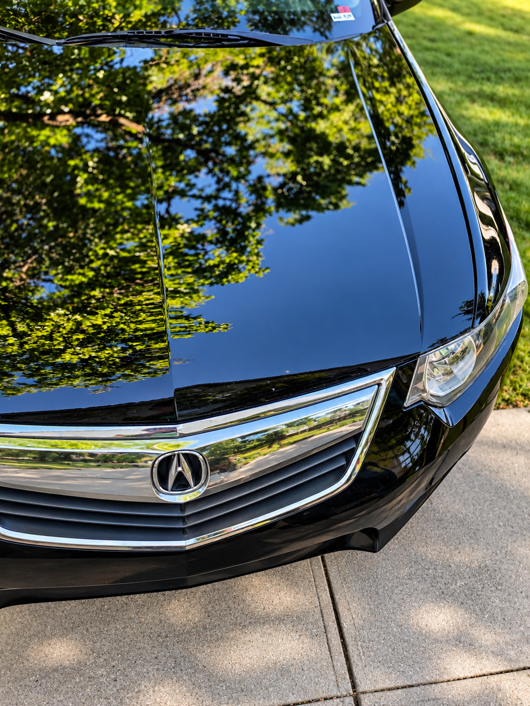 Reflective Acura hood after correction and protection prep